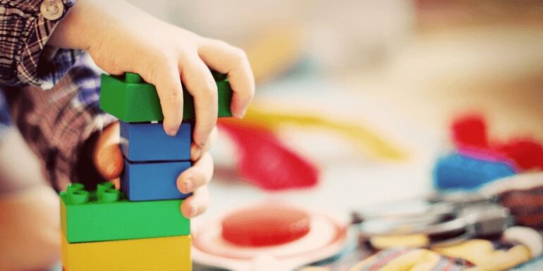 A child building with blocks.